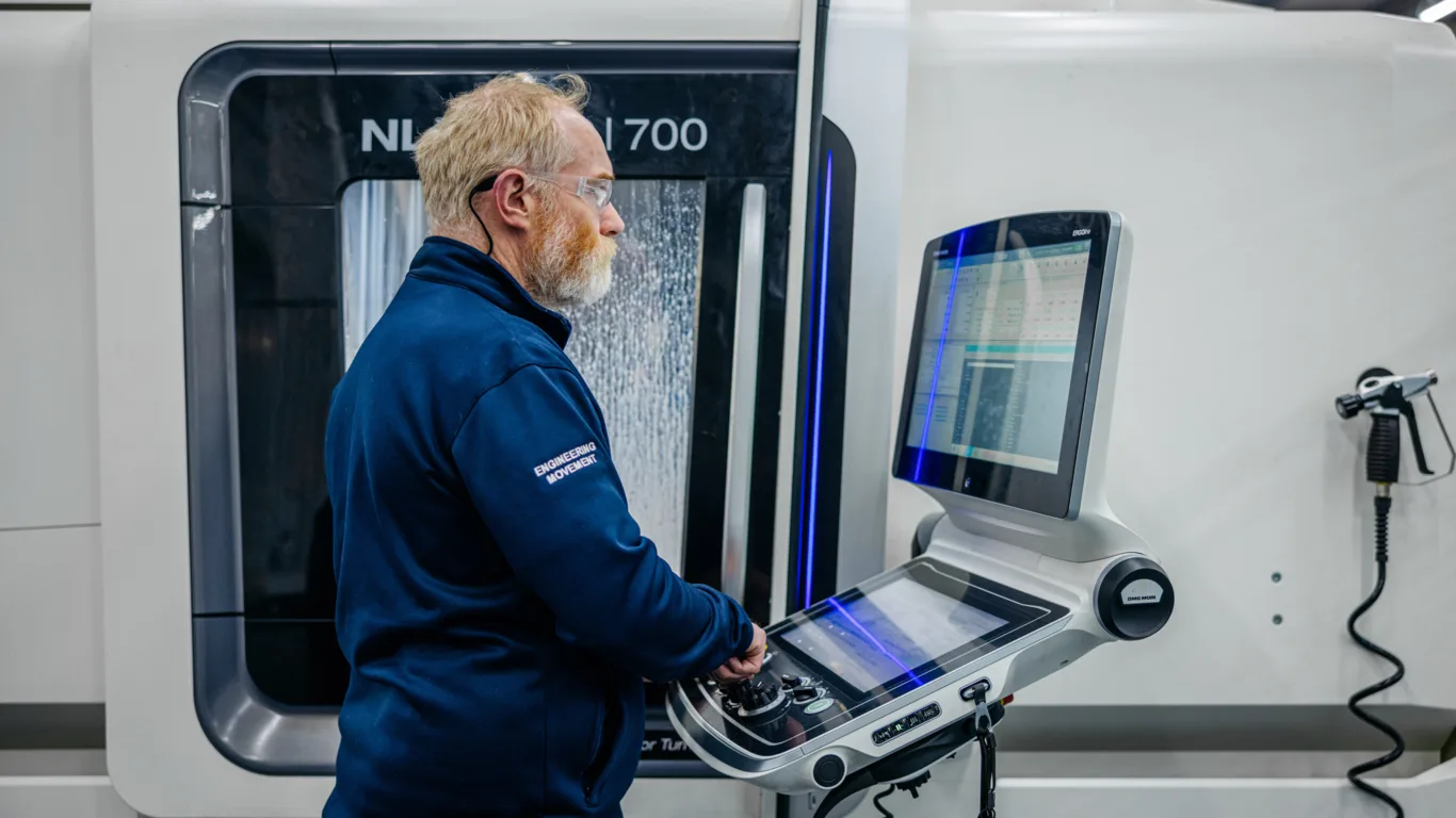 Croom Medical engineer at the control of a CNC machining centre